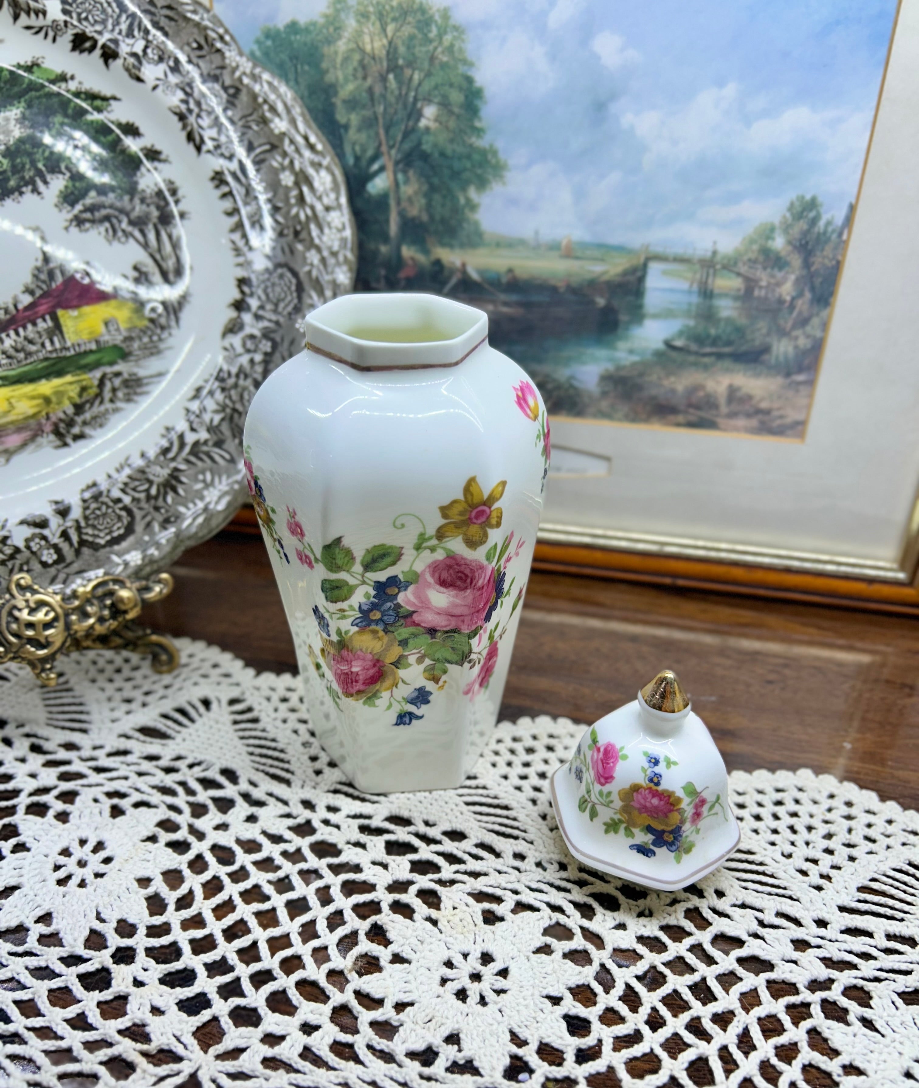 Vintage crown Staffordshire ginger jar — features a a vibrant floral pattern topped with a gold-accented lid 11”
