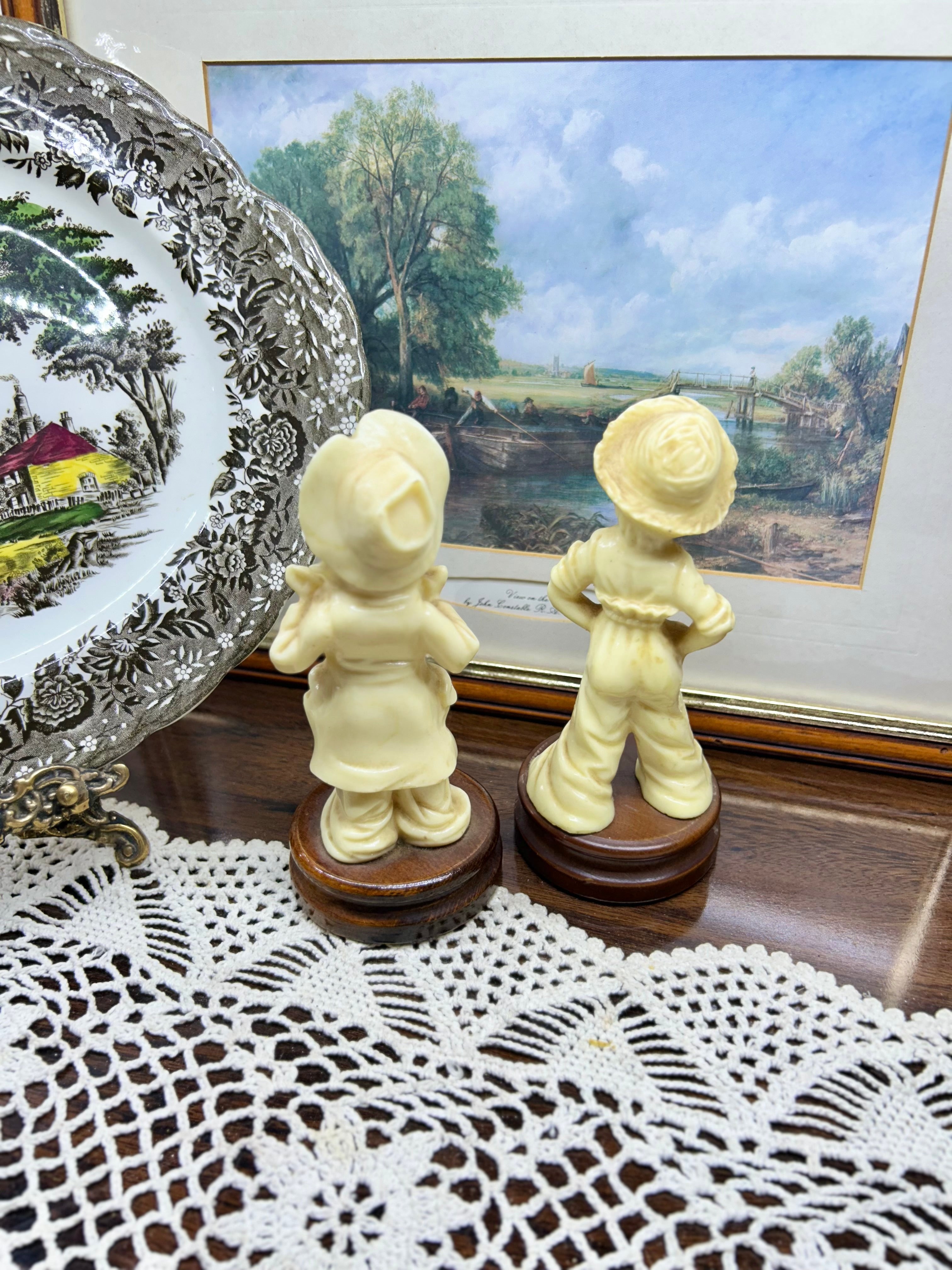 Vintage pair of Italian-made sculptures with wooden bases