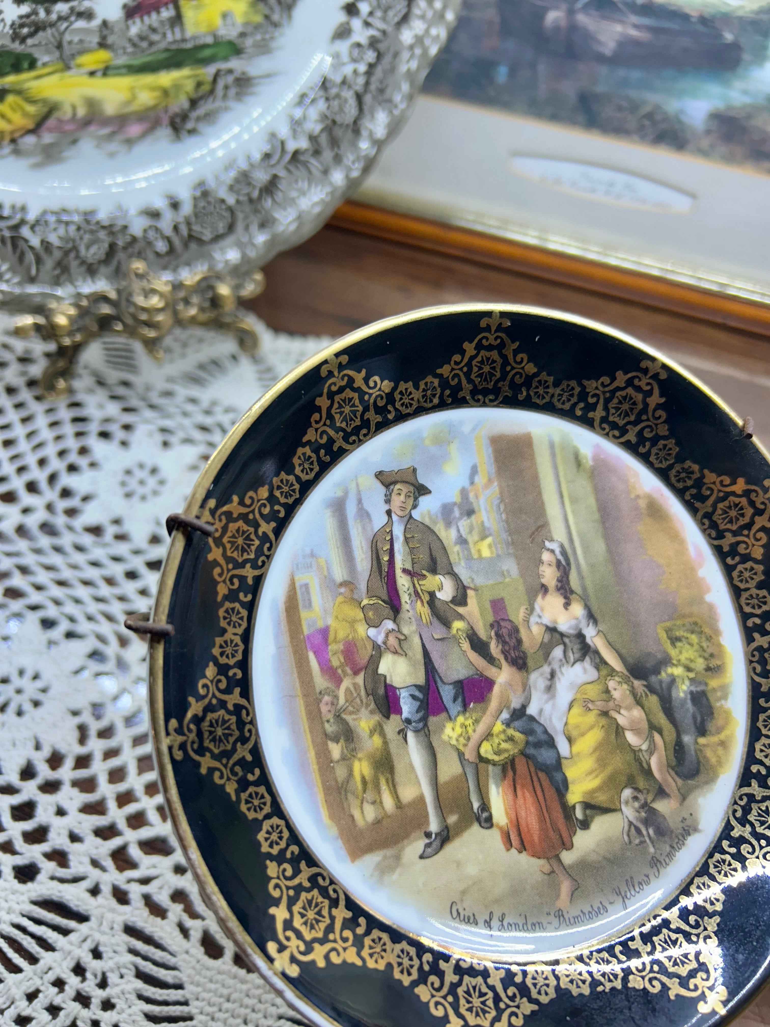 Vintage collector plate featuring a "Cries of London" scene, produced by Regency Bone China