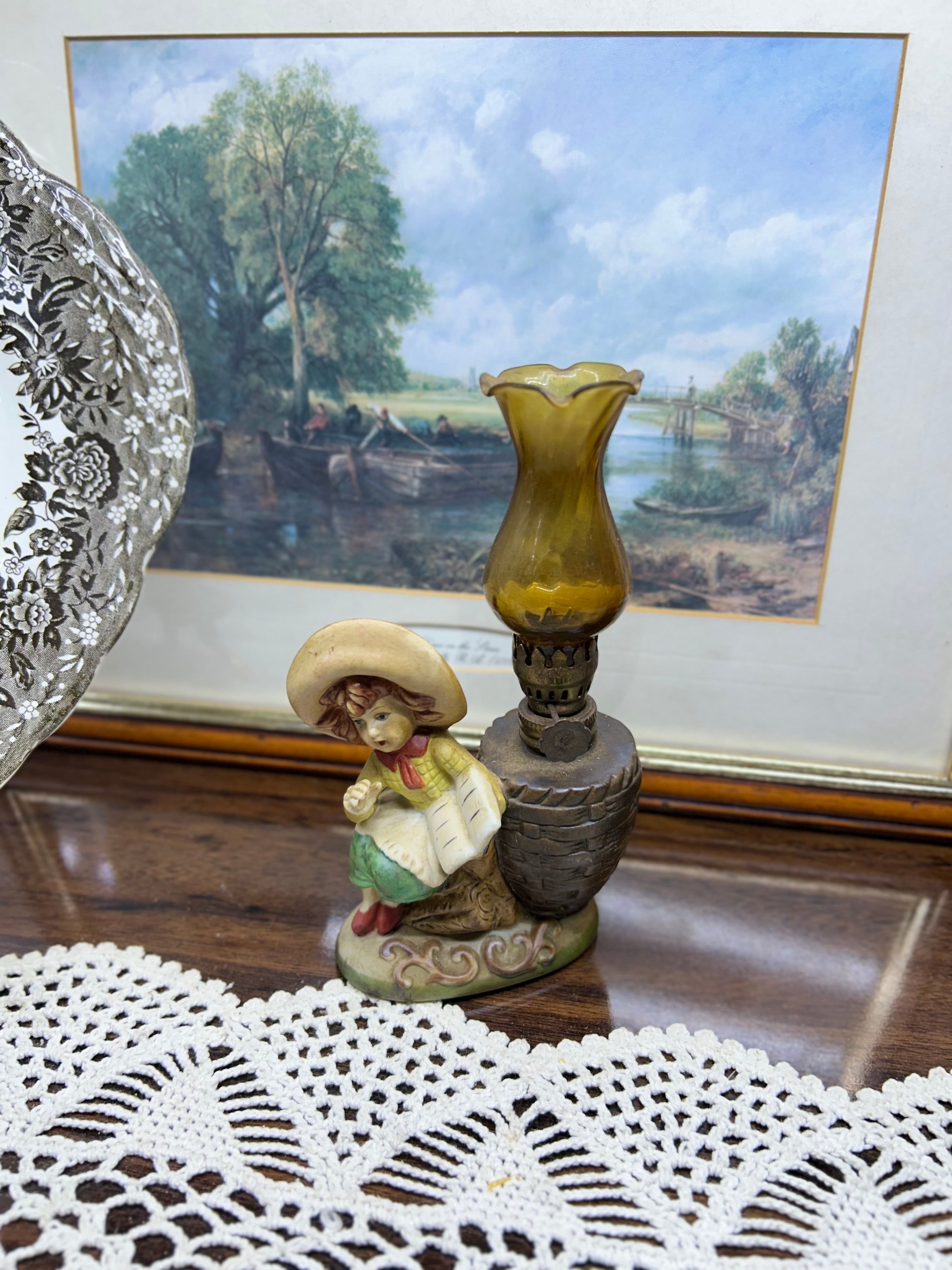 Vintage kerosene oil lamp with little girl with book in ceramic 
Height
