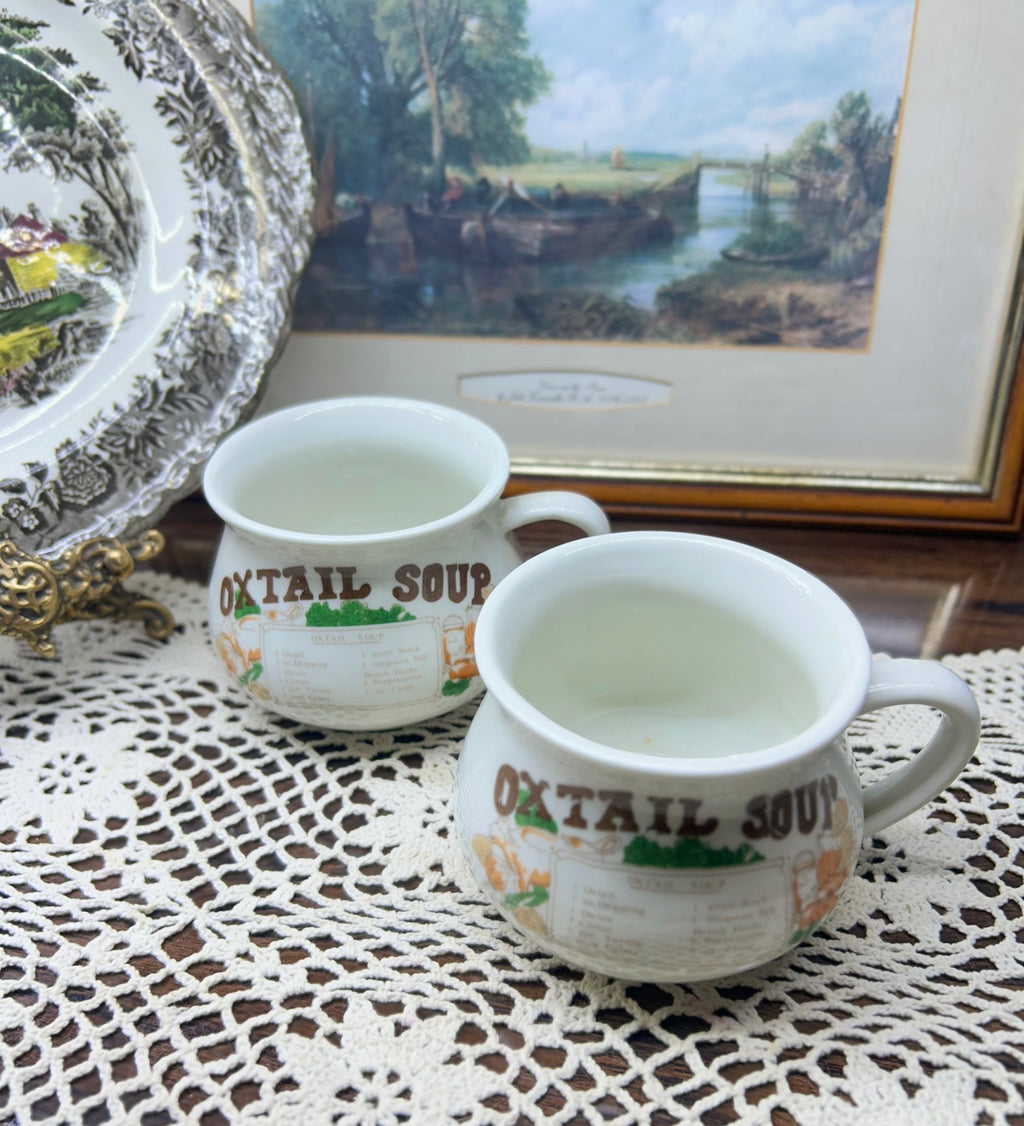 Retro ceramic soup mugs featuring an Oxtail Soup recipe design — pair