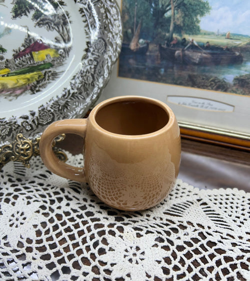 Beige reindeer mug with red nose and antler details — cermaic