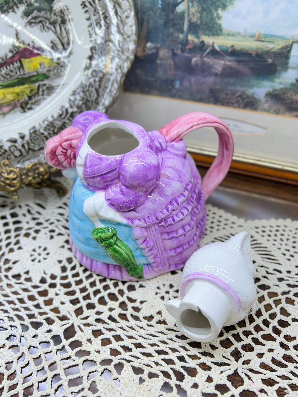 vintage ceramic novelty teapot featuring a cat dressed in a Victorian-style purple dress and bonnet 7”