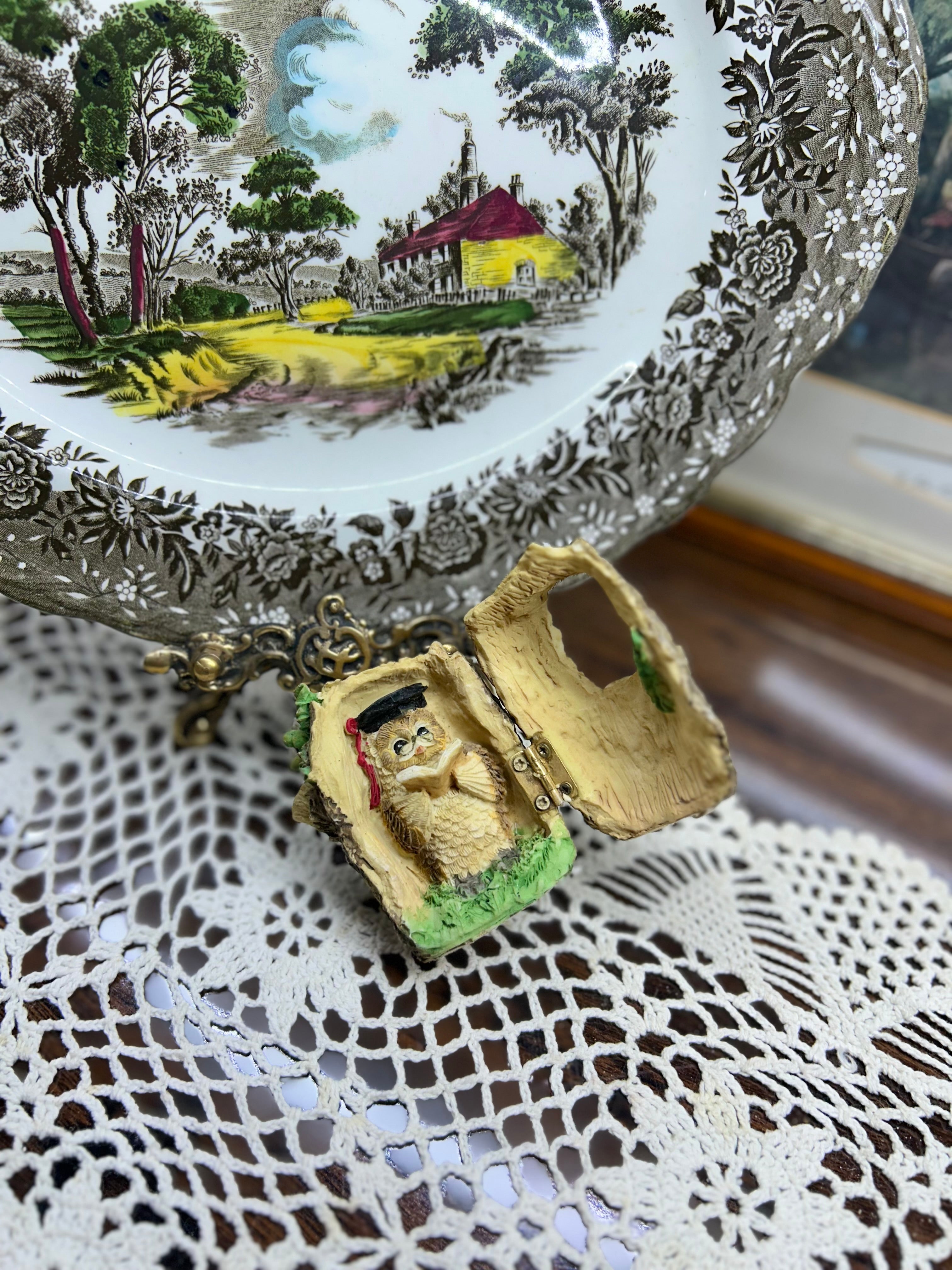 Vintage scholarly owl figurine depicted reading inside a tree stump - 1995