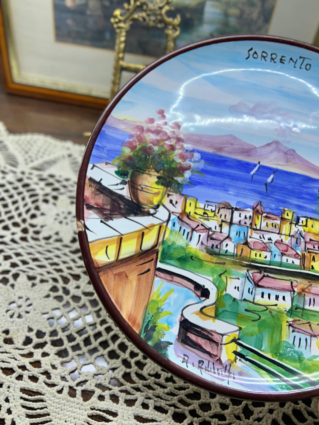 hand-painted ceramic decorative plate featuring a scene from Sorrento, Italy.