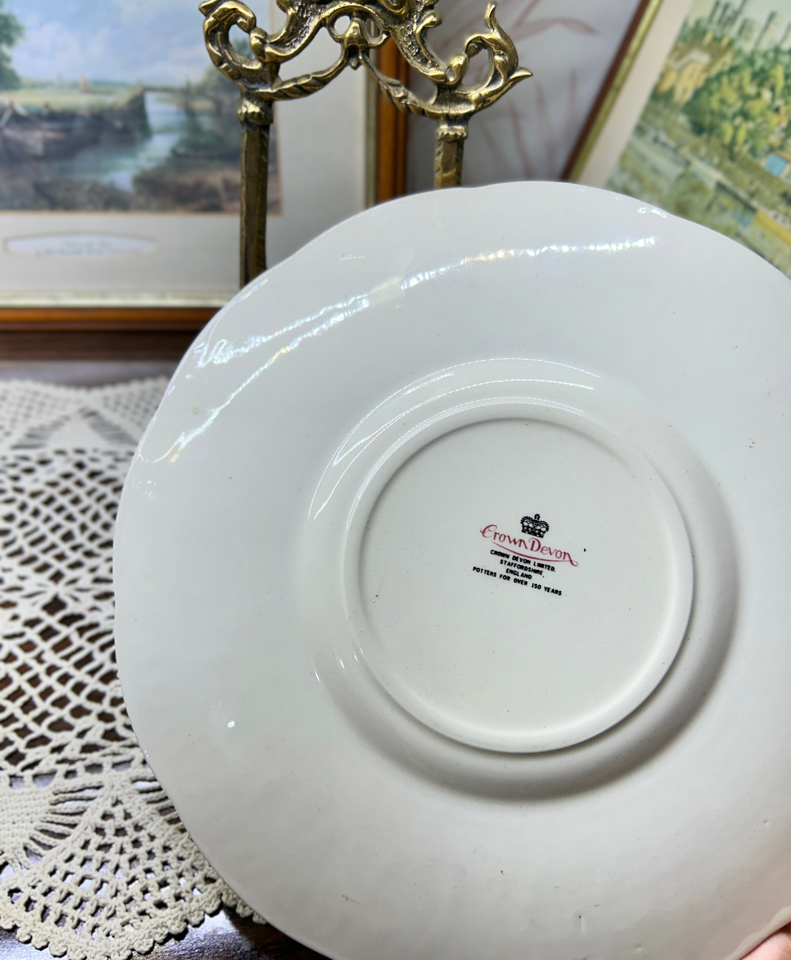 Vintage Crown Ducal Rose Marie pattern wall plate featuring a pink-tinted rim and a central rose bouquet 12”
