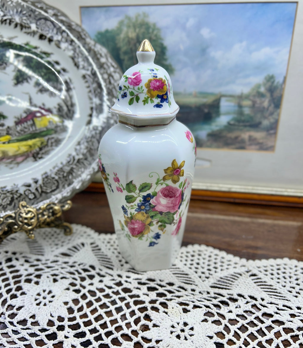 Vintage crown Staffordshire ginger jar — features a a vibrant floral pattern topped with a gold-accented lid 11”
