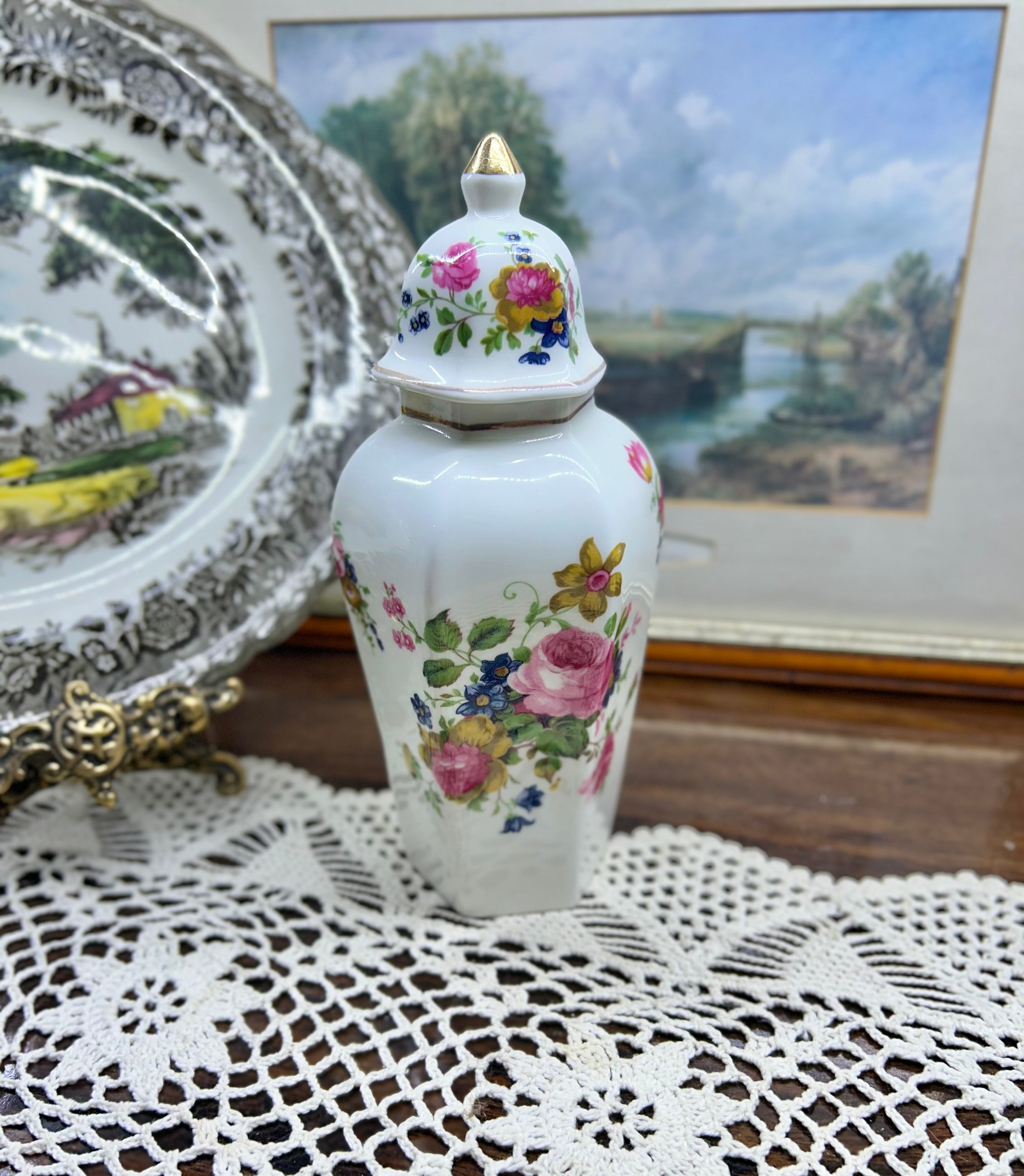 Vintage crown Staffordshire ginger jar — features a a vibrant floral pattern topped with a gold-accented lid 11”