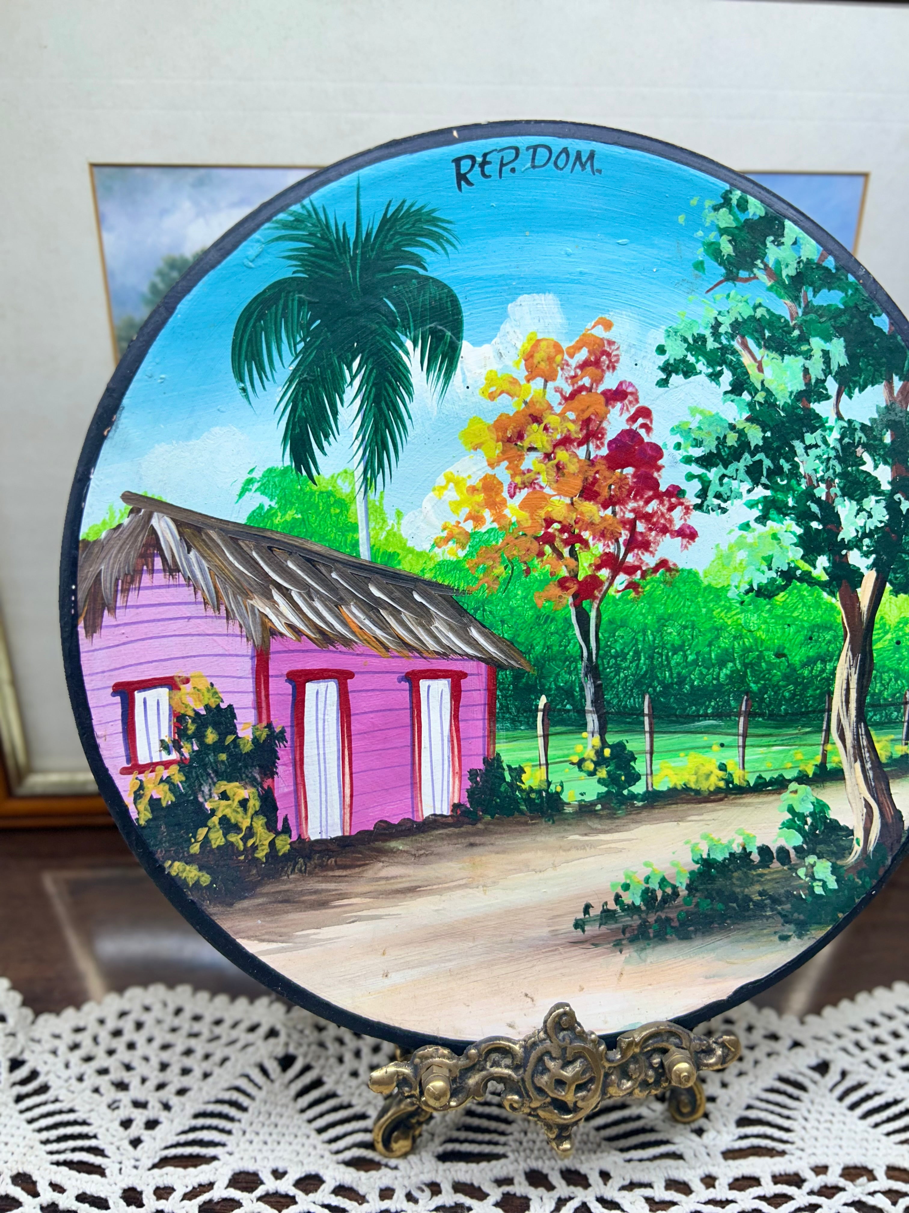 Hand-painted decorative plate featuring a vibrant Caribbean landscape from the Dominican Republic