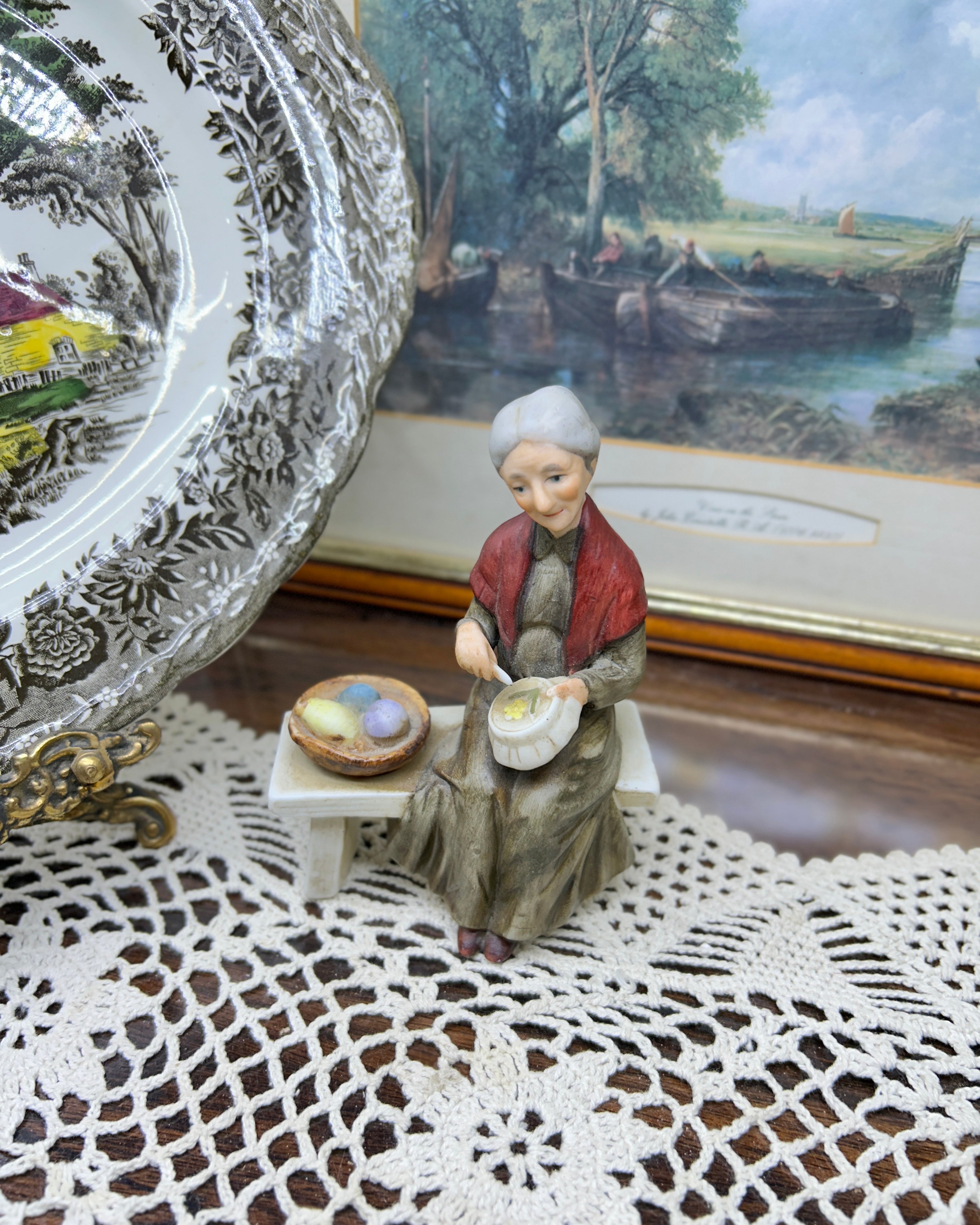 Vintage capodimonte figurine featuring an old lady sitting on a bench —  5”