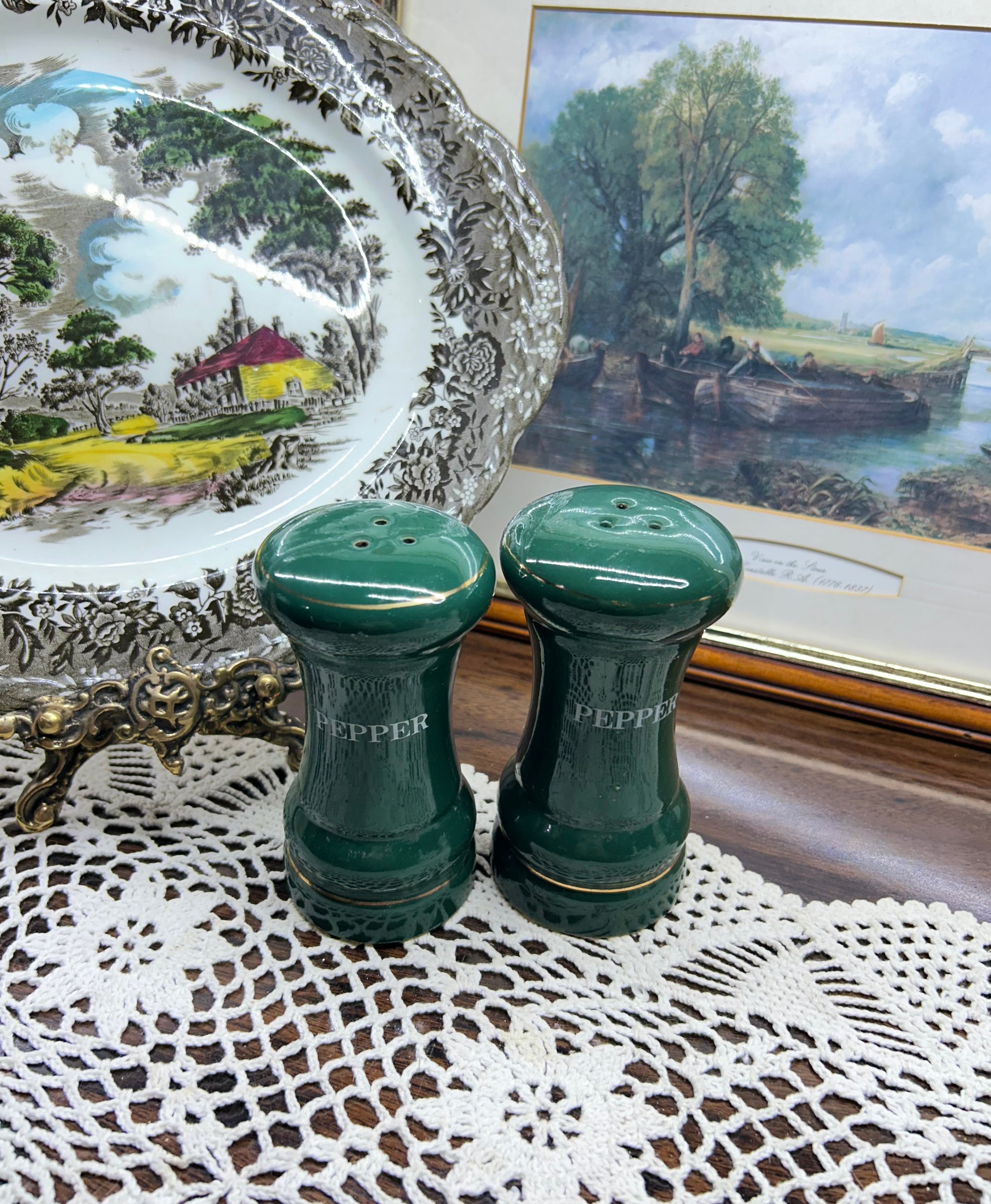 vintage green porcelain salt and pepper shakers feature gold trim and are labeled "PEPPER"