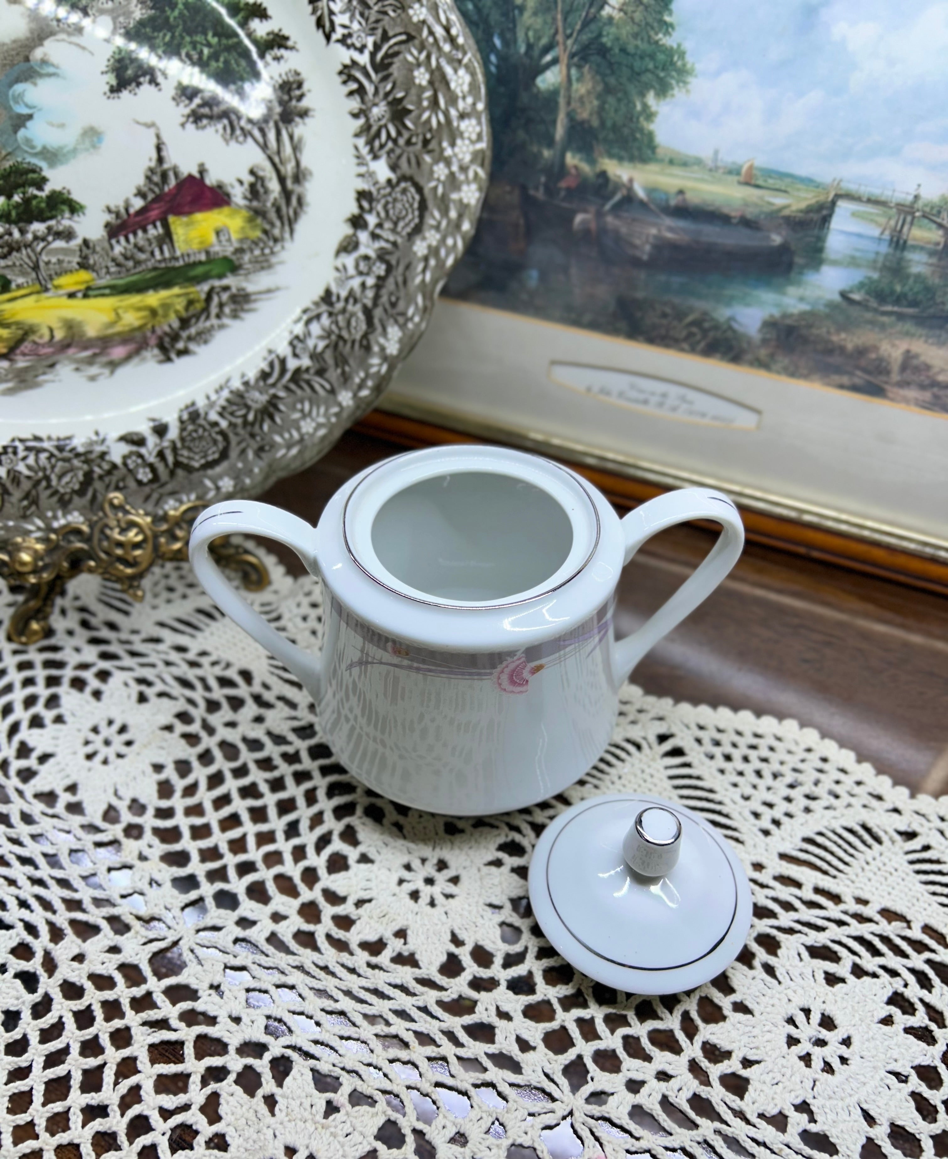 Vintage porcelain lidded sugar pot with silver rim