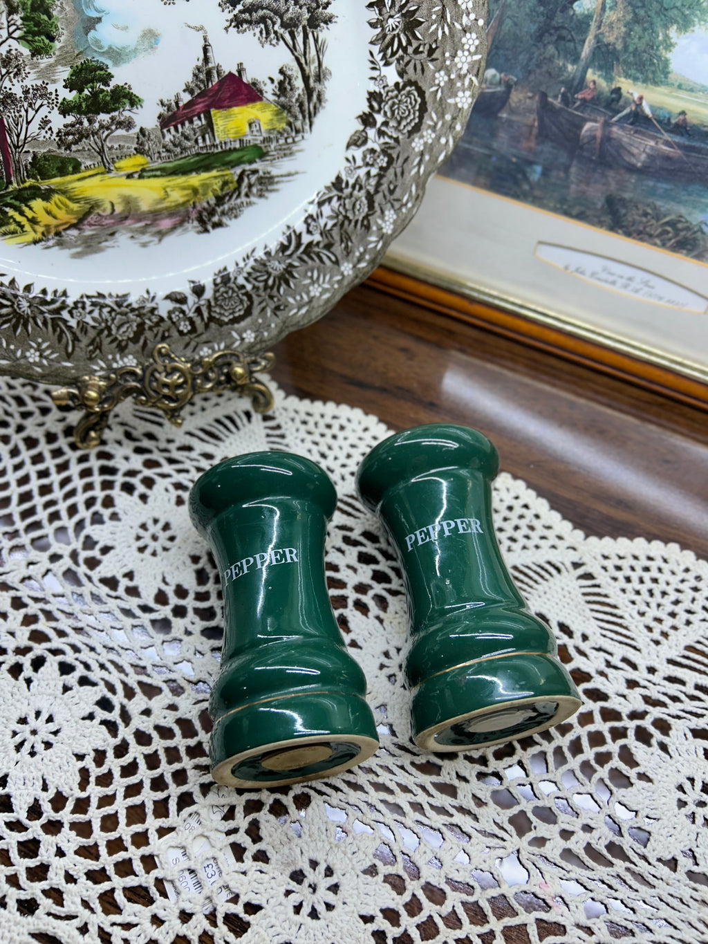 vintage green porcelain salt and pepper shakers feature gold trim and are labeled "PEPPER"