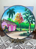 Hand-painted decorative plate featuring a vibrant Caribbean landscape from the Dominican Republic