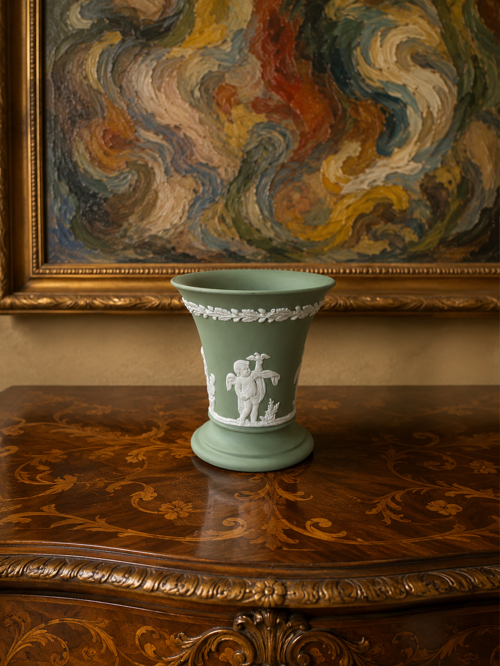 Vintage Wedgwood sage green Jasperware flared trumpet vase — featuring neoclassical putti bas-relief figures.