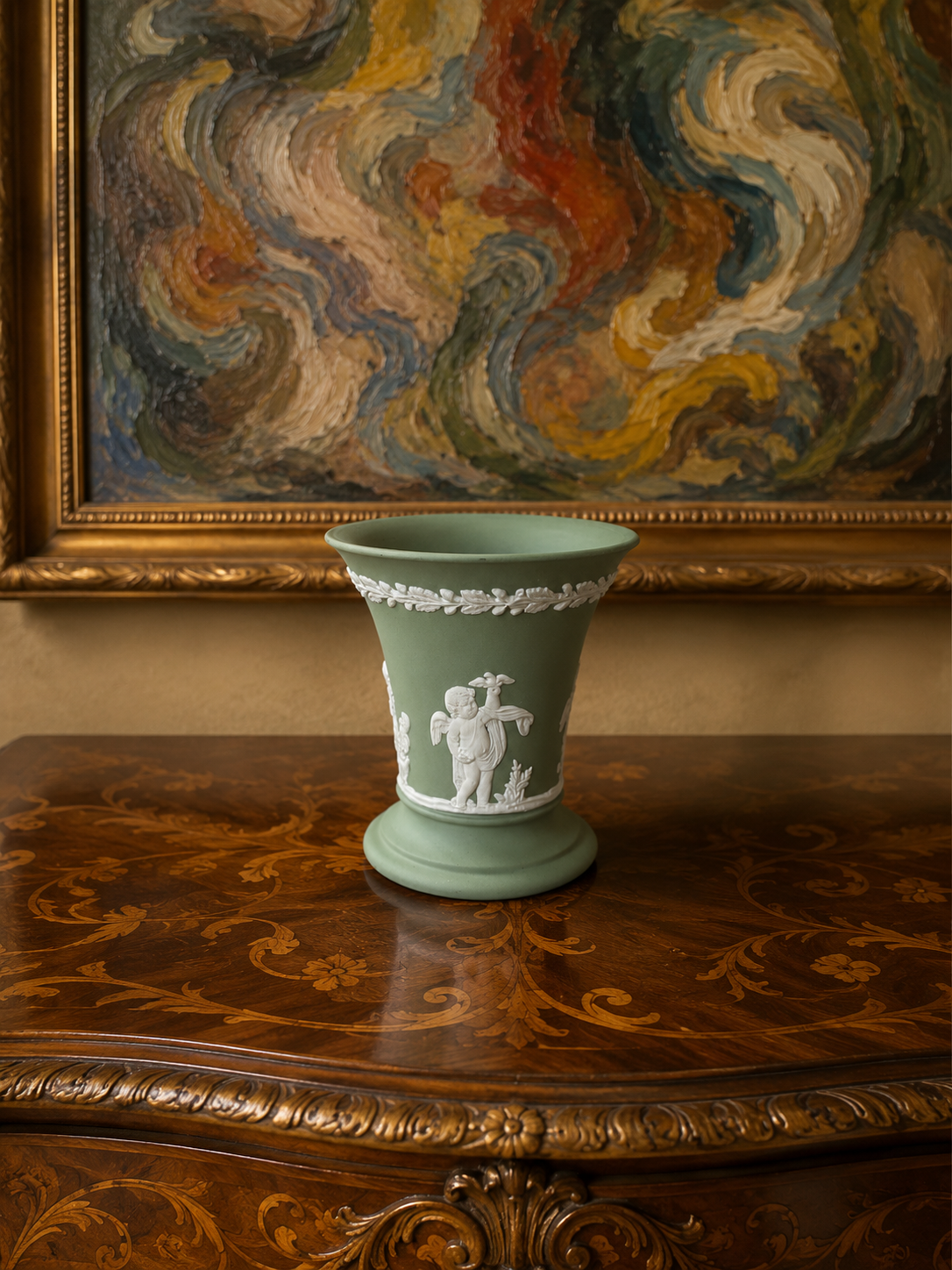 Vintage Wedgwood sage green Jasperware flared trumpet vase — featuring neoclassical putti bas-relief figures.